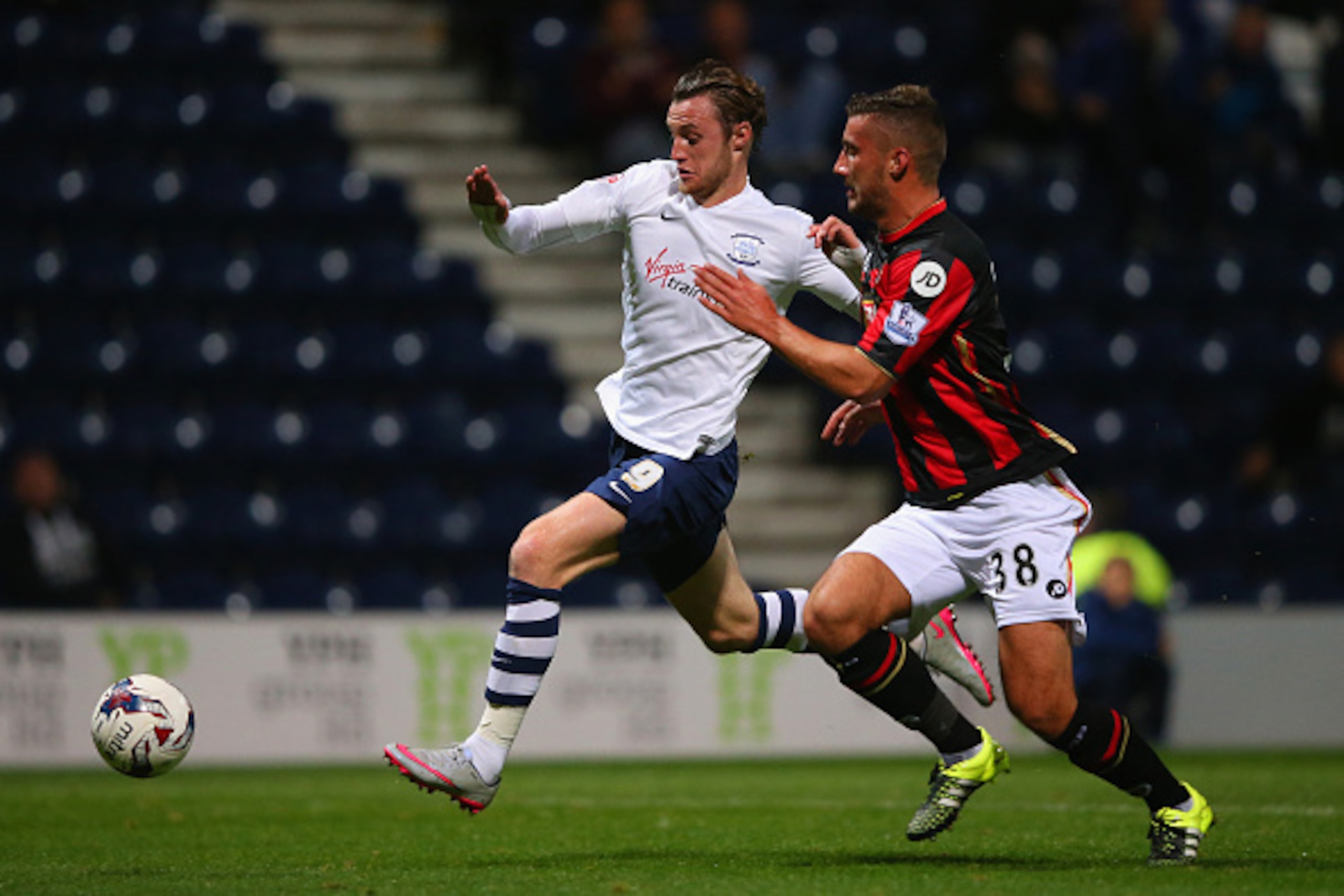 PRESTON, ENGLAND - SEPTEMBER 22:  Baily Cargill of Bournemouth and Will Keane of Preston North End battle for the ball during the Capital One Cup third round match between Preston North End and AFC Bournemouth at Deepdale on September 22, 2015 in Preston,