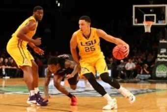 Nov 24, 2015; Brooklyn , NY, USA;  LSU Tigers forward Ben Simmons (25) drives past North Carolina State Wolfpack guard Anthony Barber (12) during the second half in the consolation game of the Legends Classic at Barclays Center. North Carolina State Wolfp