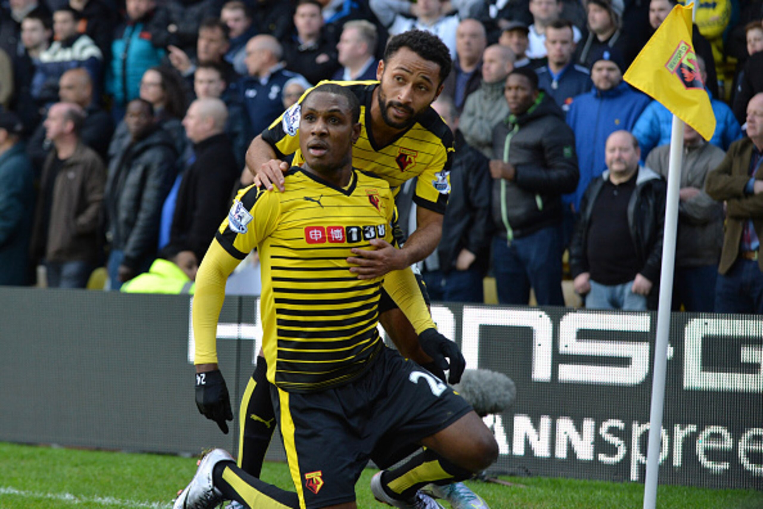Watford's Nigerian striker Odion Ighalo (L) celebrates with Watford's Scottish midfielder Ikechi Anya after scoring their first goal during the English Premier League football match between Watford and Tottenham Hotspur at Vicarage Road Stadium in Watford