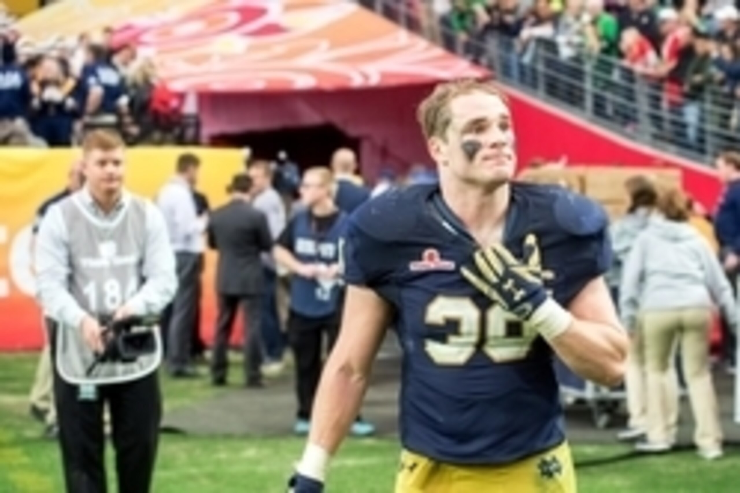 Jan 1, 2016; Glendale, AZ, USA; Notre Dame Fighting Irish linebacker Joe Schmidt (38) pauses as he leaves the field following the 2016 Fiesta Bowl at University of Phoenix Stadium. The Ohio State Buckeyes defeated Notre Dame 44-28. Mandatory Credit: Matt 