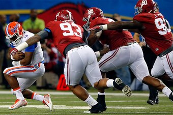 ATLANTA, GA - DECEMBER 5: Quarterback Treon Harris #3 of the Florida Gators is sacked by defensive lineman Jonathan Allen #93 of the Alabama Crimson Tide, defensive lineman A'Shawn Robinson #86 of the Alabama Crimson Tide, and defensive lineman Jarran Ree