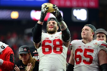 GLENDALE, AZ - JANUARY 01: Offensive lineman Taylor Decker #68 of the Ohio State Buckeyes holds the Fiesta Bowl trophy after the BattleFrog Fiesta Bowl at University of Phoenix Stadium on January 1, 2016 in Glendale, Arizona. The Ohio State Buckeyes beat 