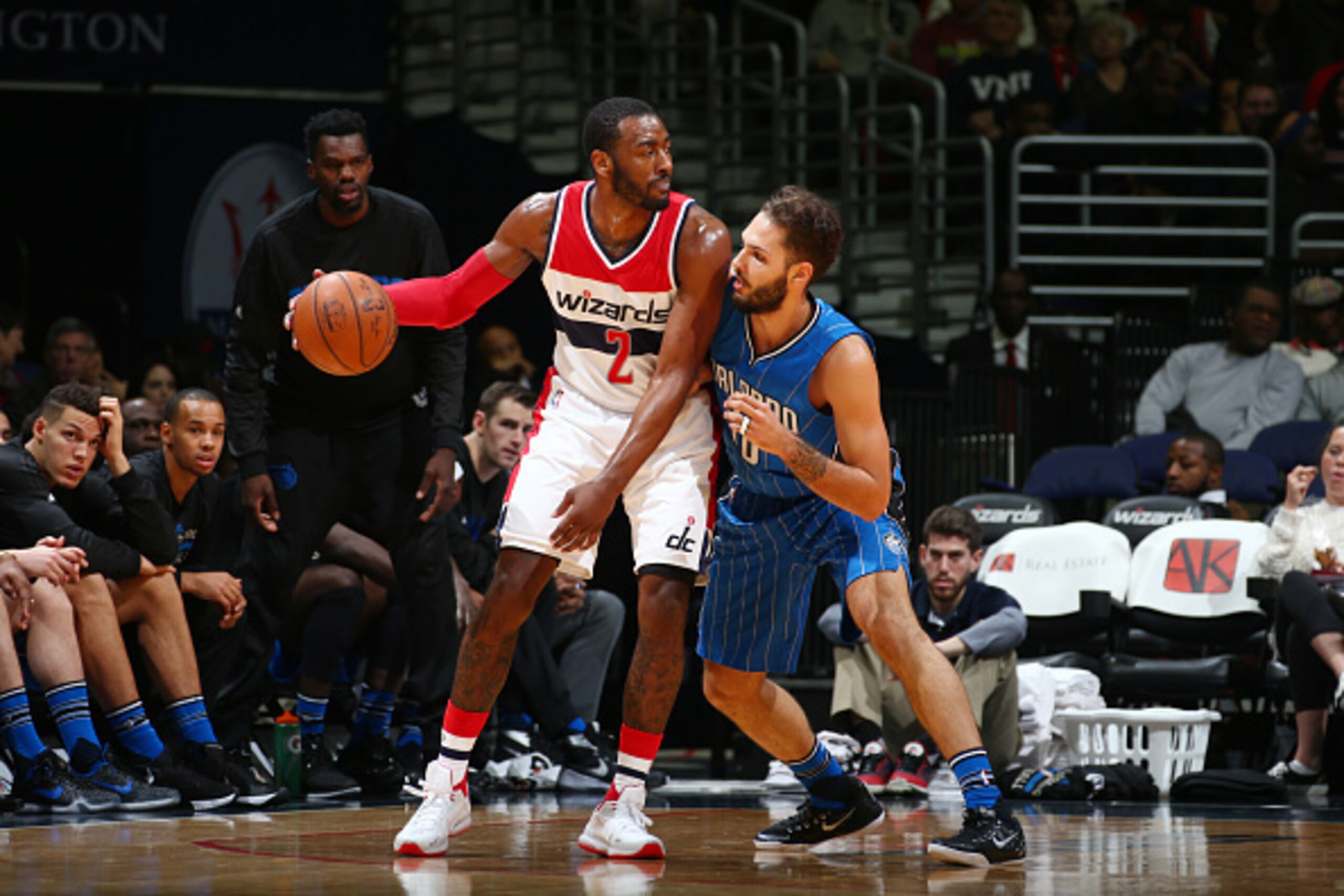 WASHINGTON, DC - JANUARY 1: John Wall #2 of the Washington Wizards defends the ball against Nikola Vucevic #9 of the Orlando Magic during the game on January 1, 2016 at Verizon Center in Washington, District of Columbia. NOTE TO USER: User expressly ackno