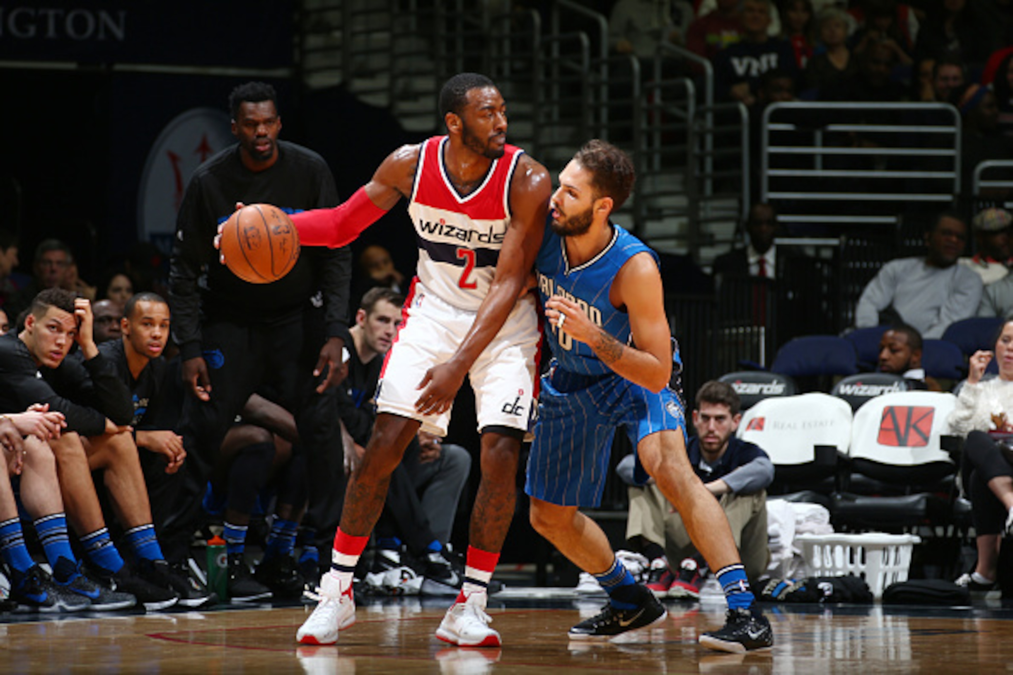 WASHINGTON, DC - JANUARY 1: John Wall #2 of the Washington Wizards defends the ball against Nikola Vucevic #9 of the Orlando Magic during the game on January 1, 2016 at Verizon Center in Washington, District of Columbia. NOTE TO USER: User expressly ackno