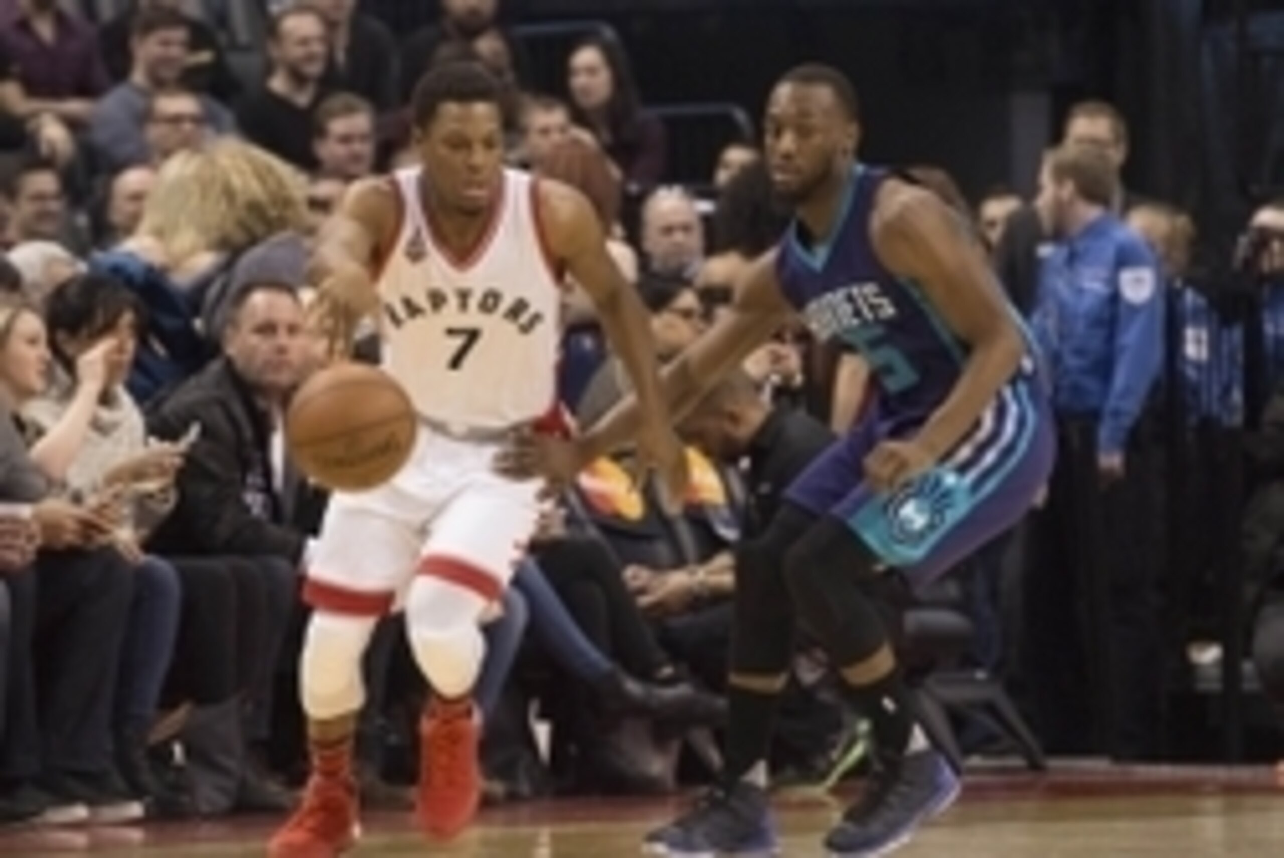 Jan 1, 2016; Toronto, Ontario, CAN; Toronto Raptors guard Kyle Lowry (7) controls the ball as Charlotte Hornets guard Kemba Walker (15) tries to defend during the first quarter in a game at Air Canada Centre. Mandatory Credit: Nick Turchiaro-USA TODAY Spo
