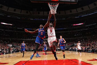 CHICAGO, IL - JANUARY 1: Bobby Portis #5 of the Chicago Bulls goes for the dunk against Langston Galloway #2 of the New York Knicks during the game on January 1, 2016 at United Center in Chicago, Illinois. NOTE TO USER: User expressly acknowledges and agr