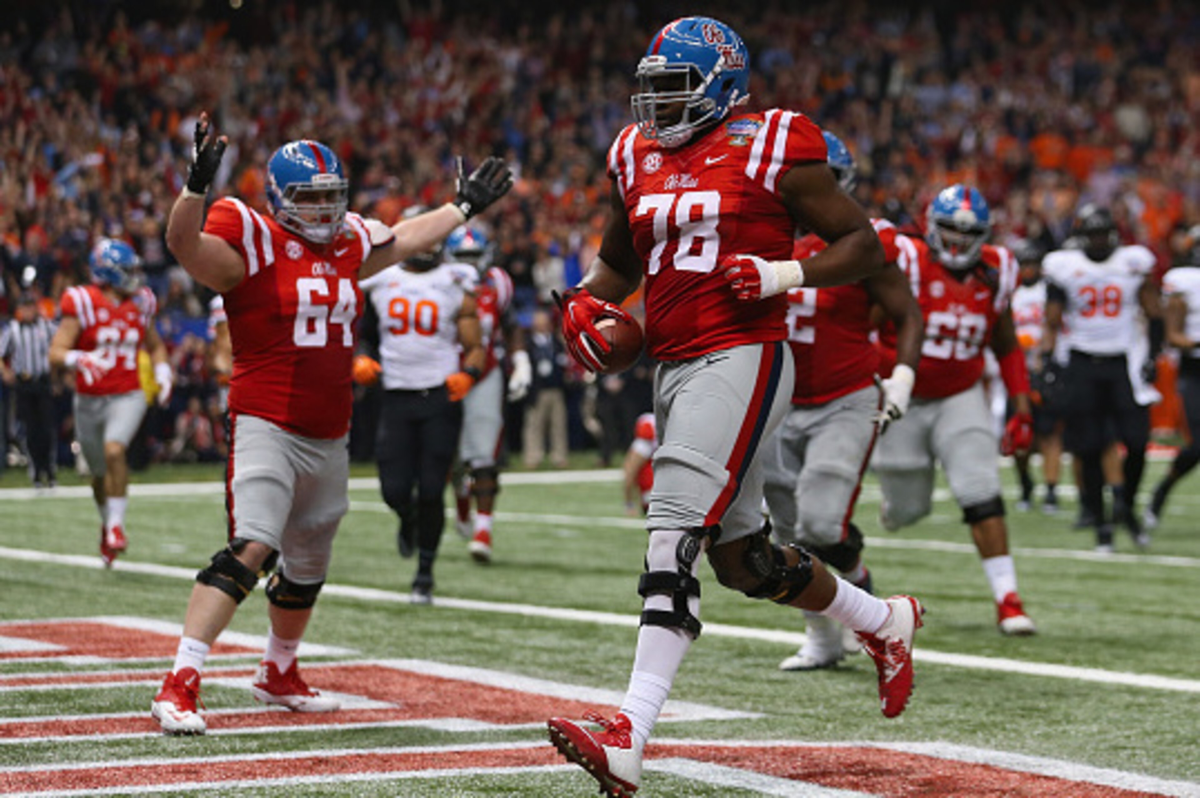 NEW ORLEANS, LA - JANUARY 01:  Laremy Tunsil #78 of the Mississippi Rebels scores runs in a touchdown during the second quarter against the Oklahoma State Cowboys in the Allstate Sugar Bowl at Mercedes-Benz Superdome on January 1, 2016 in New Orleans, Lou