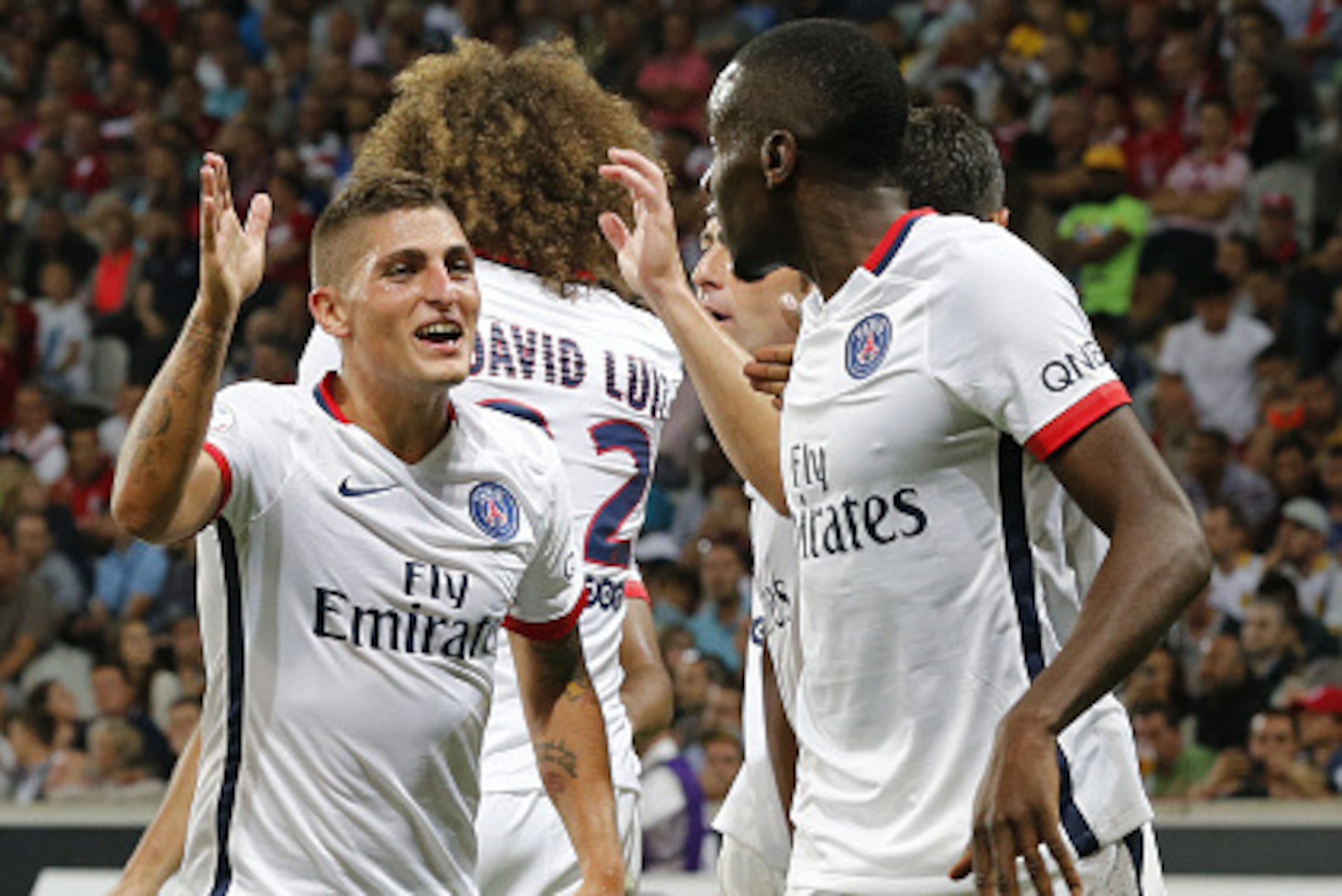 LILLE - AUGUST 7: Marco Verratti of PSG and Blaise Matuidi of PSG celebrates Lucas Moura's goal during the French Ligue 1 match between Lille OSC (LOSC) and Paris Saint-Germain (PSG) at Grand Stade Pierre Mauroy on August 7, 2015 in Lille, France. (Photo