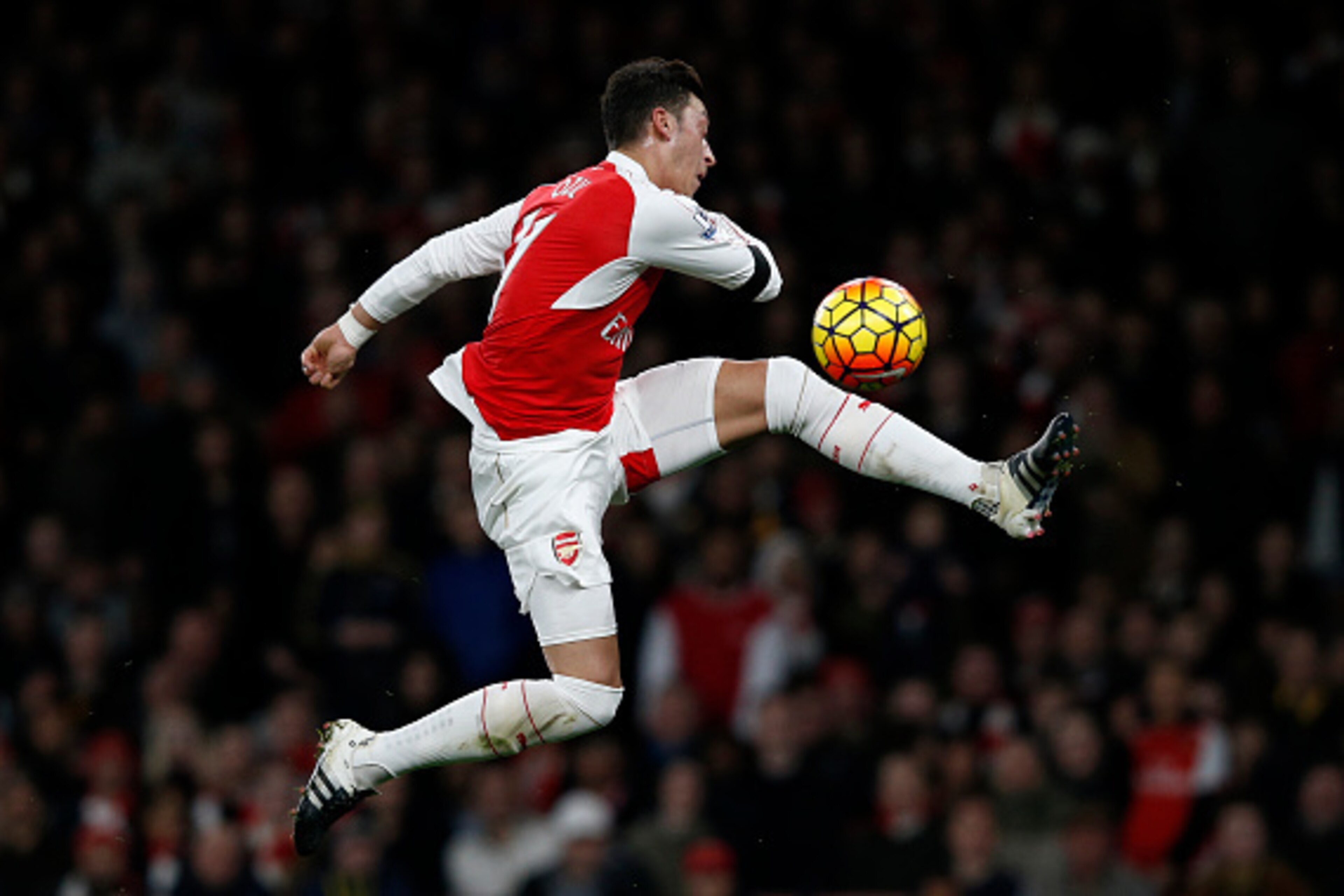Arsenal's German midfielder Mesut Ozil has an unsuccessful shot during the English Premier League football match between Arsenal and Bournemouth at the Emirates Stadium in London on December 28, 2015. Arsenal won the game 2-0. AFP PHOTO / ADRIAN DENNIS

R