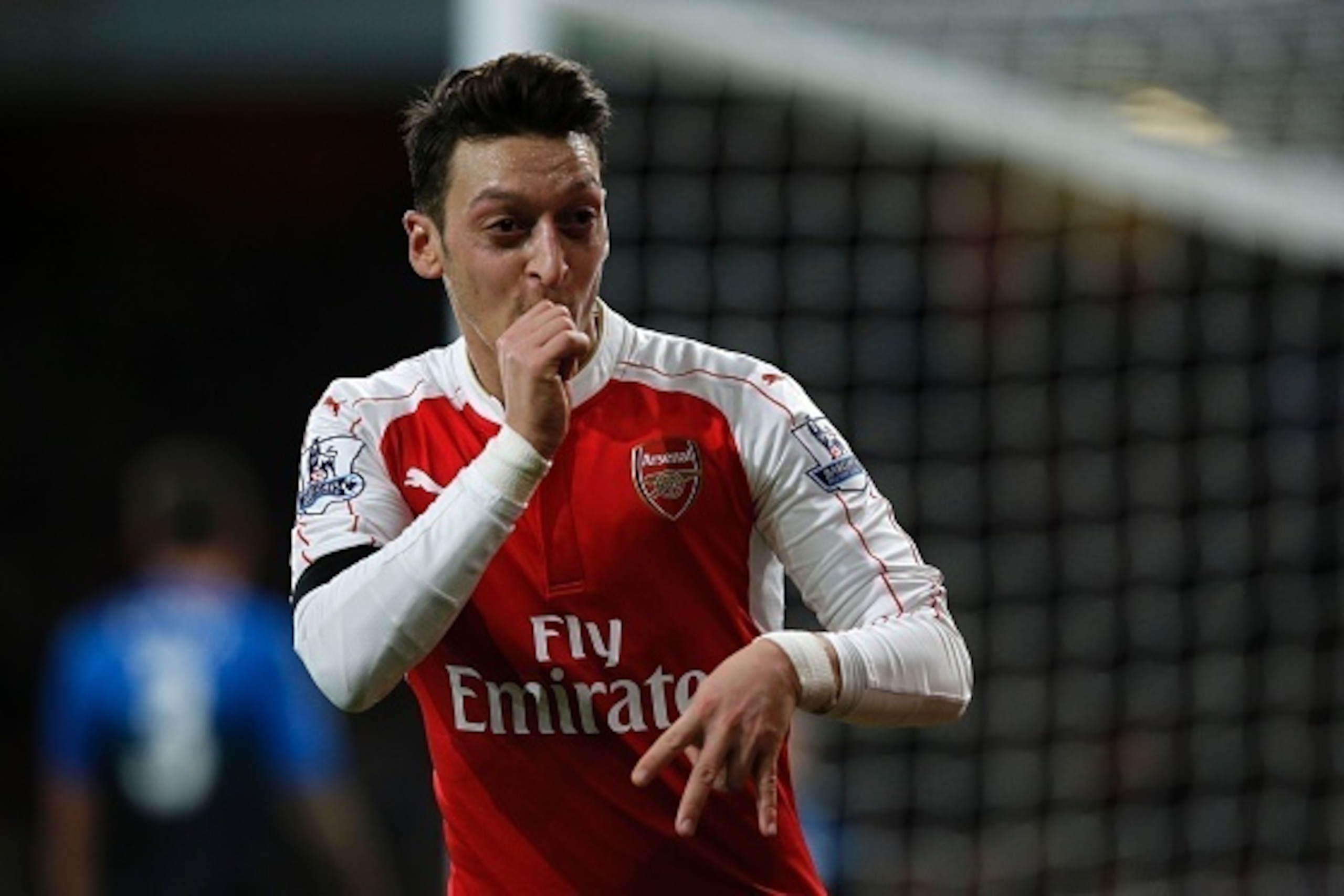 Arsenal's German midfielder Mesut Ozil celebrates after scoring their second goal during the English Premier League football match between Arsenal and Bournemouth at the Emirates Stadium in London on December 28, 2015. AFP PHOTO / ADRIAN DENNIS
RESTRICTE Arsenal's German midfielder Mesut Ozil celebrates after scoring their second goal during the English Premier League football match between Arsenal and Bournemouth at the Emirates Stadium in London on December 28, 2015. AFP PHOTO / ADRIAN DENNIS
RESTRICTE