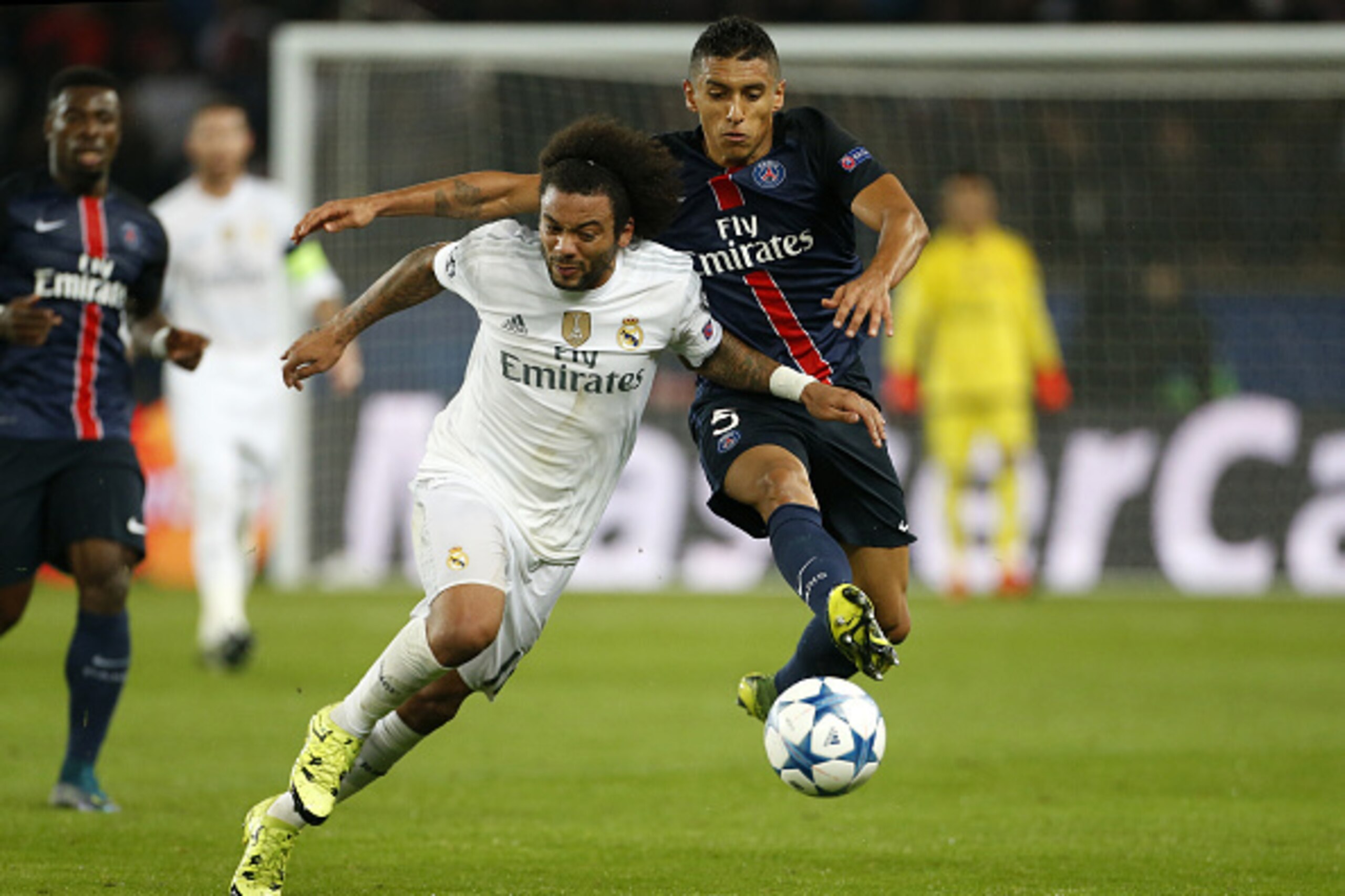 PARIS, FRANCE - OCTOBER 21: Marcelo of Real Madrid and Marquinhos of PSG in action during the UEFA Champions League match between Paris Saint-Germain (PSG) and Real Madrid at Parc des Princes stadium on October 21, 2015 in Paris, France. (Photo by Jean Ca
