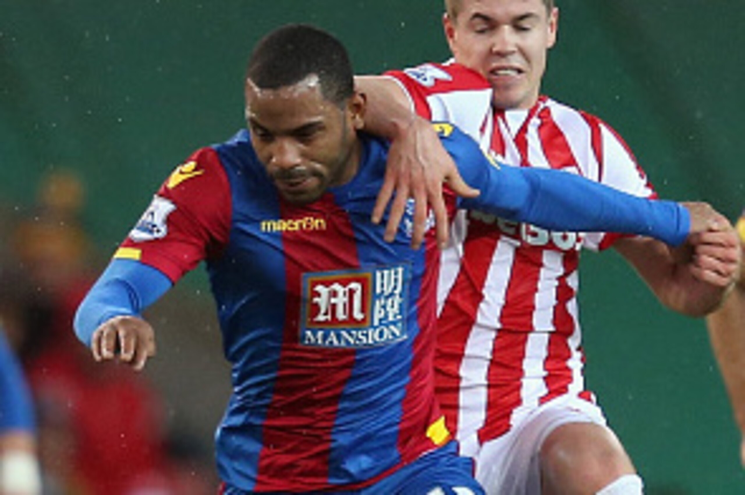 STOKE ON TRENT, ENGLAND - DECEMBER 19: Jason Puncheon of Crystal Palace and Marco van Ginkel of Stoke City compete for the ball during the Barclays Premier League match between Stoke City and Crystal Palace at the Britannia Stadium on December 19, 2015 in