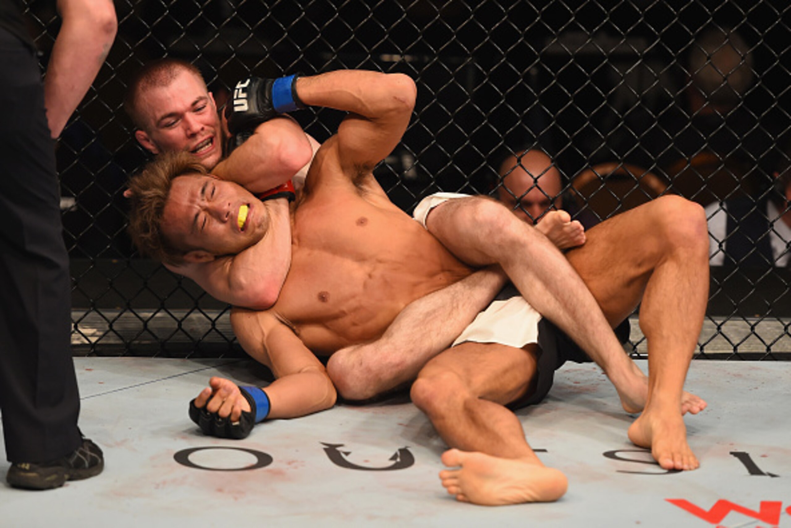 LAS VEGAS, NV - JANUARY 02: Michael McDonald (top) attempts to submit Masanori Kanehara of Japan in their bantamweight bout during the UFC 195 event inside MGM Grand Garden Arena on January 2, 2016 in Las Vegas, Nevada. (Photo by Josh Hedges/Zuffa LLC/Z LAS VEGAS, NV - JANUARY 02: Michael McDonald (top) attempts to submit Masanori Kanehara of Japan in their bantamweight bout during the UFC 195 event inside MGM Grand Garden Arena on January 2, 2016 in Las Vegas, Nevada. (Photo by Josh Hedges/Zuffa LLC/Z