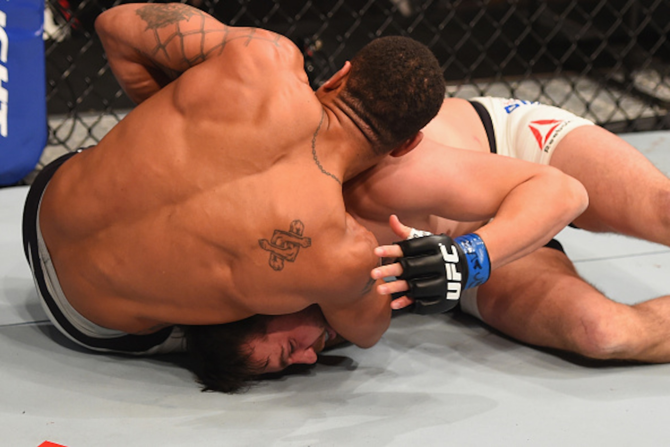 LAS VEGAS, NV - JANUARY 02: (L-R) Abel Trujillo attempts to submit Tony Sims in their lightweight bout during the UFC 195 event inside MGM Grand Garden Arena on January 2, 2016 in Las Vegas, Nevada. (Photo by Josh Hedges/Zuffa LLC/Zuffa LLC via Getty Ima LAS VEGAS, NV - JANUARY 02: (L-R) Abel Trujillo attempts to submit Tony Sims in their lightweight bout during the UFC 195 event inside MGM Grand Garden Arena on January 2, 2016 in Las Vegas, Nevada. (Photo by Josh Hedges/Zuffa LLC/Zuffa LLC via Getty Ima