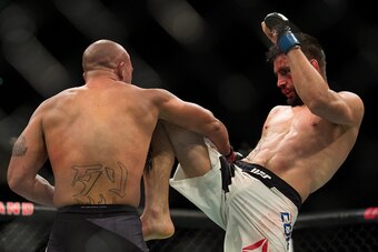 LAS VEGAS, NV - JANUARY 02:  (R-L) Carlos Condit knees Robbie Lawler in their welterweight championship fight during the UFC 195 event inside MGM Grand Garden Arena on January 2, 2016 in Las Vegas, Nevada.  (Photo by Brandon Magnus/Zuffa LLC/Zuffa LLC via