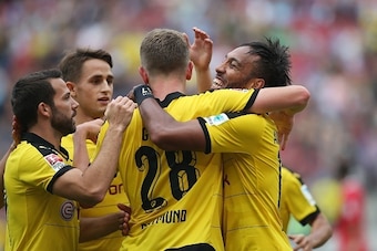 (L-R) Dortmund's midfielder Gonzalo Castro, Belgian midfielder Adnan Januzaj, defender Matthias Ginter and Gabonese striker Pierre-Emerick Aubameyang celebrate their team's fourth goal during the German first division Bundesliga football match Hannover 96