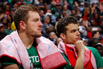 ATLANTA, GA - NOVEMBER 24:  David Lee #42 and R.J. Hunter #28 of the Boston Celtics look on during the fourth quarter of their 121-97 loss to the Atlanta Hawks at Philips Arena on November 24, 2015 in Atlanta, Georgia.  NOTE TO USER User expressly acknowl