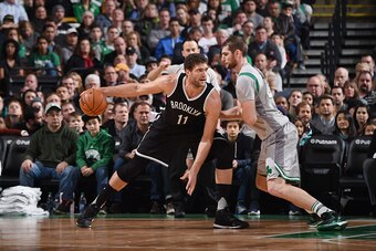 BOSTON, MA - JANUARY 2:  Brook Lopez #11 of the Brooklyn Nets posts up against Tyler Zeller #44 of the Boston Celtics on January 2, 2016 at the TD Garden in Boston, Massachusetts.  NOTE TO USER: User expressly acknowledges and agrees that, by downloading 
