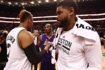 Dec 30, 2015; Boston, MA, USA; Los Angeles Lakers forward Kobe Bryant (C) shakes hands with Boston Celtics center Jared Sullinger (L) and forward Amir Johnson (R) after a game at TD Garden. Mandatory Credit: Mark L. Baer-USA TODAY Sports