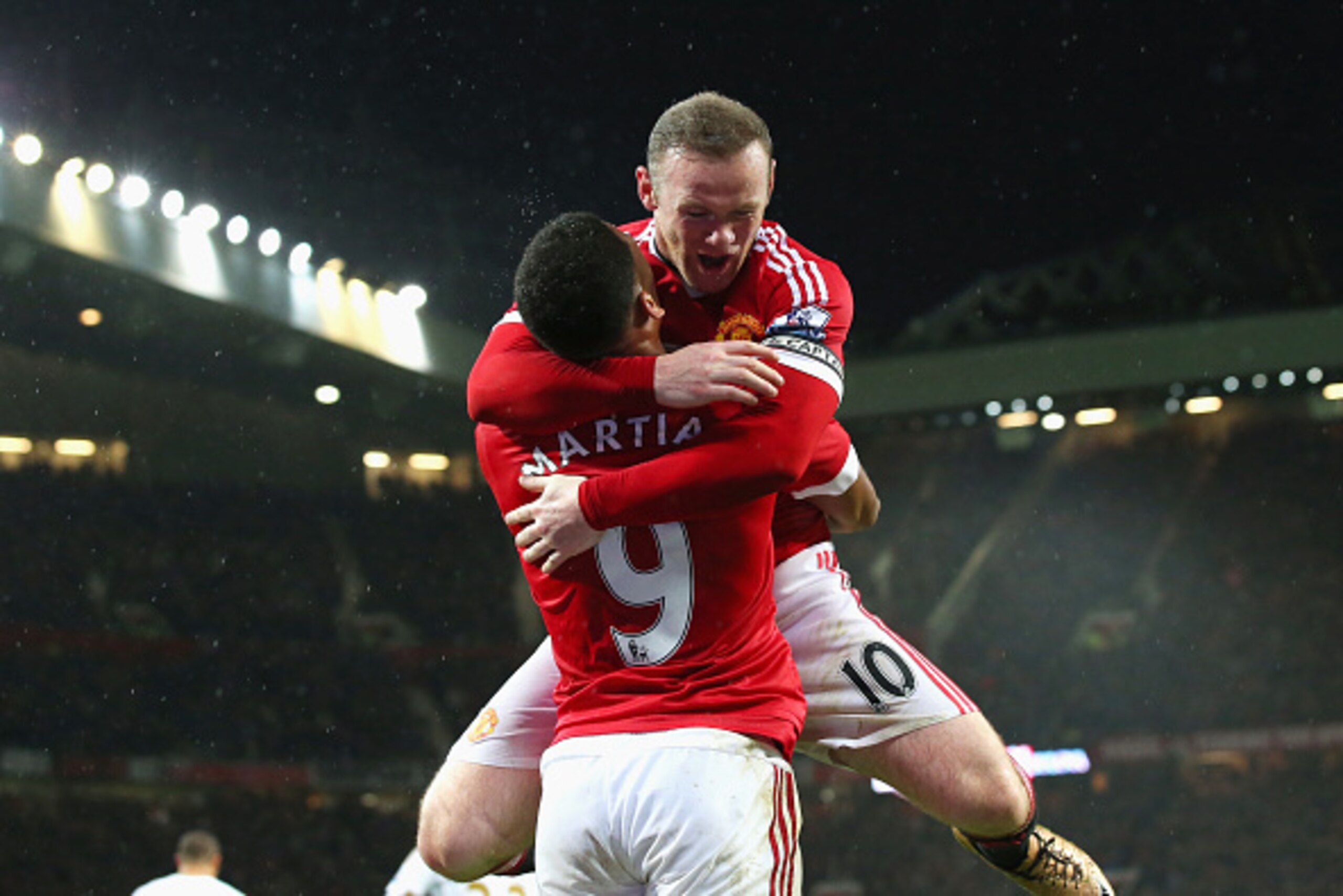 MANCHESTER, ENGLAND - JANUARY 02:  Wayne Rooney (R) of Manchester United celebrates scoring his team's second goal with his team mate Anthony Martial (L) during the Barclays Premier League match between Manchester United and Swansea City at Old Trafford o