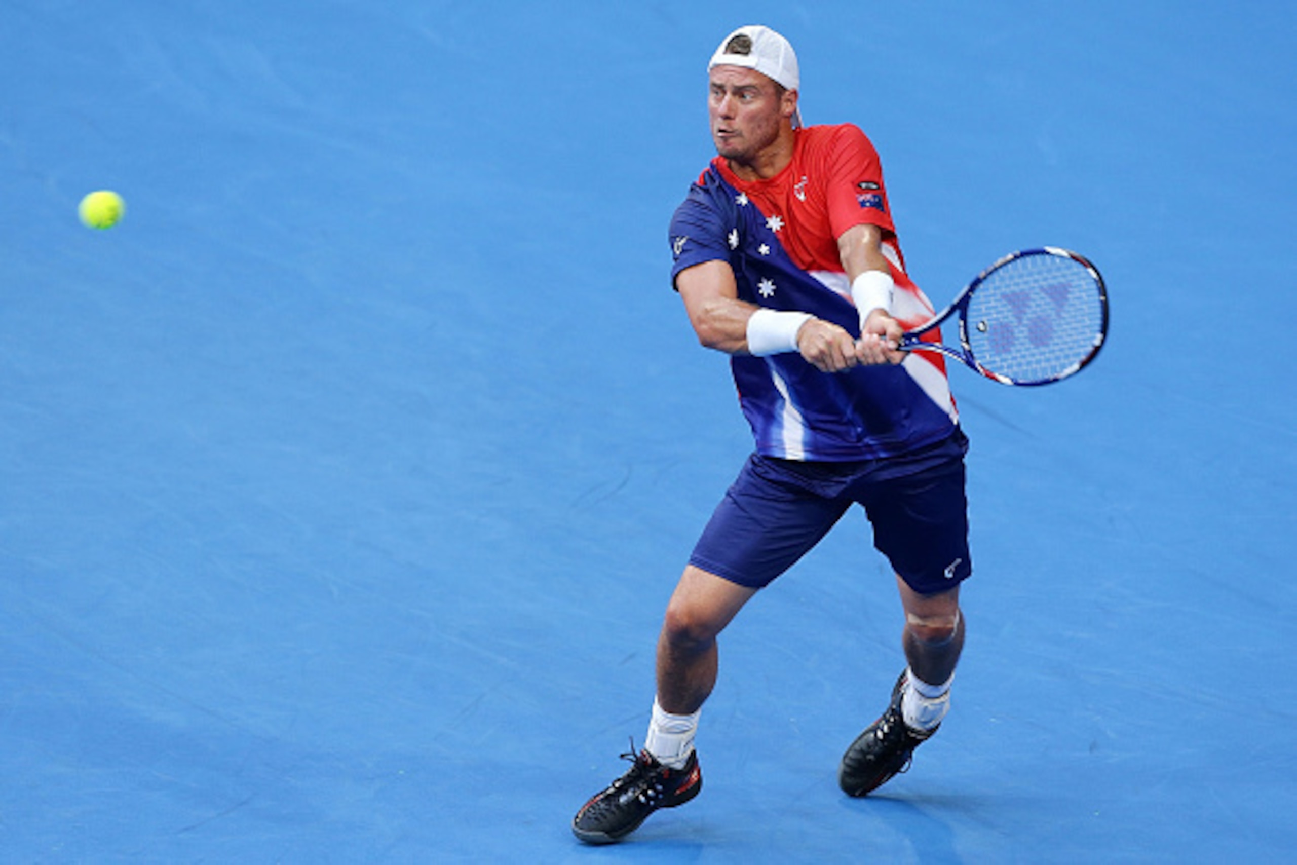PERTH, AUSTRALIA - JANUARY 03:  Lleyton Hewitt of Australia Gold plays a backhand in the men's single match against Jiri Vesely of the Czech Republic  during day one of the 2016 Hopman Cup at Perth Arena on January 3, 2016 in Perth, Australia.  (Photo by 