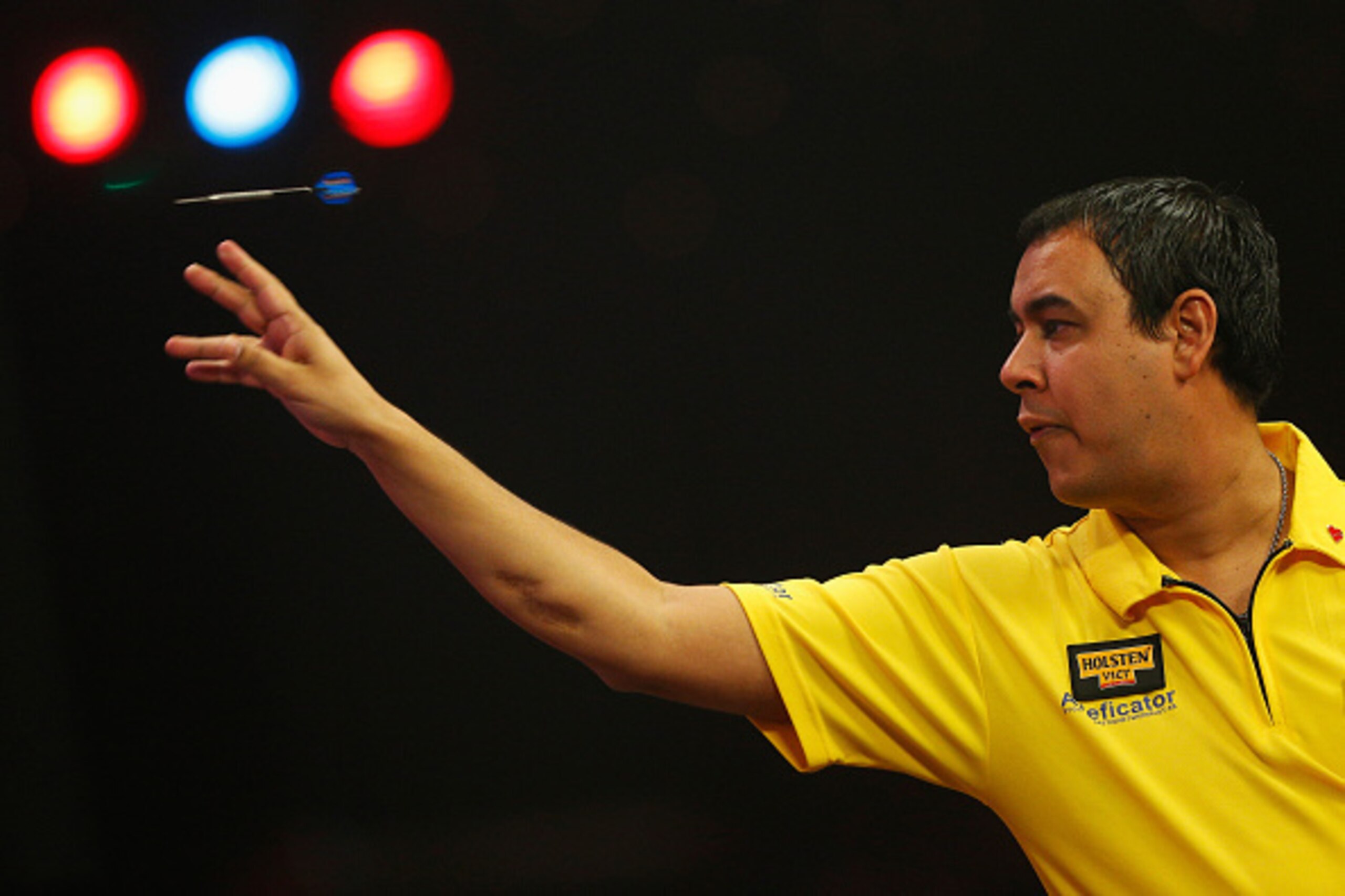 FRIMLEY, ENGLAND - JANUARY 03:  Peter Sajwani of Sweden throws during his Preliminary Round match against Sam Head of England on day one of the BDO Lakeside World Professional Darts Championships at the Lakeside Complex on January 3, 2015 in Frimley, Engl