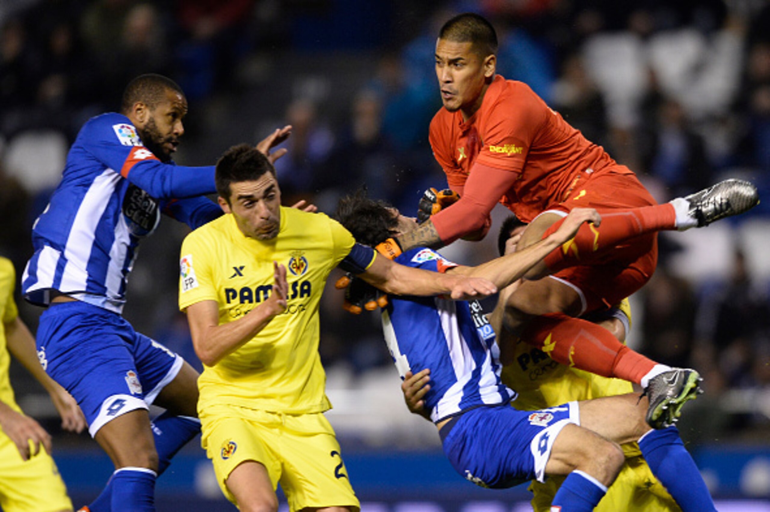 Villarreal's French goalkeeper Alphonse Areola (topR) hits Deportivo La Coruna's defender Alejandro Arribas (2ndR) past Villarreal's midfielder Bruno Soriano and Deportivo La Coruna's Brazilian defender Sidnei during the Spanish league football match RC D Villarreal's French goalkeeper Alphonse Areola (topR) hits Deportivo La Coruna's defender Alejandro Arribas (2ndR) past Villarreal's midfielder Bruno Soriano and Deportivo La Coruna's Brazilian defender Sidnei during the Spanish league football match RC D