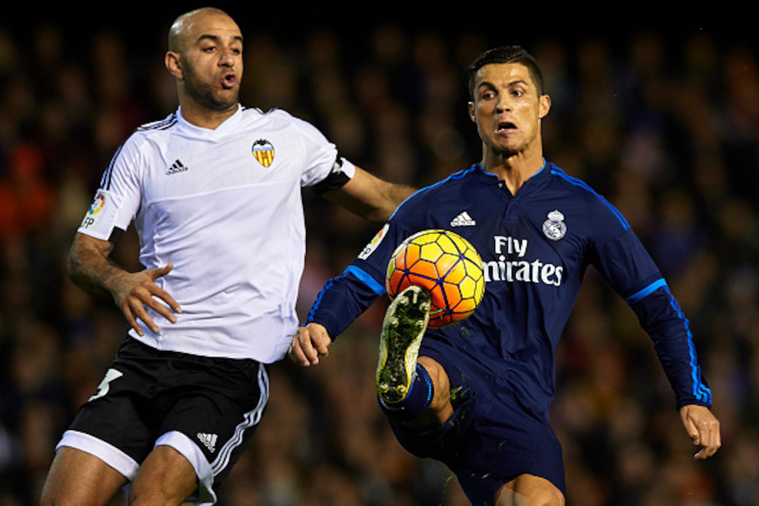 VALENCIA, SPAIN - JANUARY 03:  Aymen Abdennour of Valencia competes for the ball with Cristiano Ronaldo (R) of Real Madrid during the La Liga match between Valencia CF and Real Madrid CF at Estadi de Mestalla on January 03, 2016 in Valencia, Spain.  (Phot