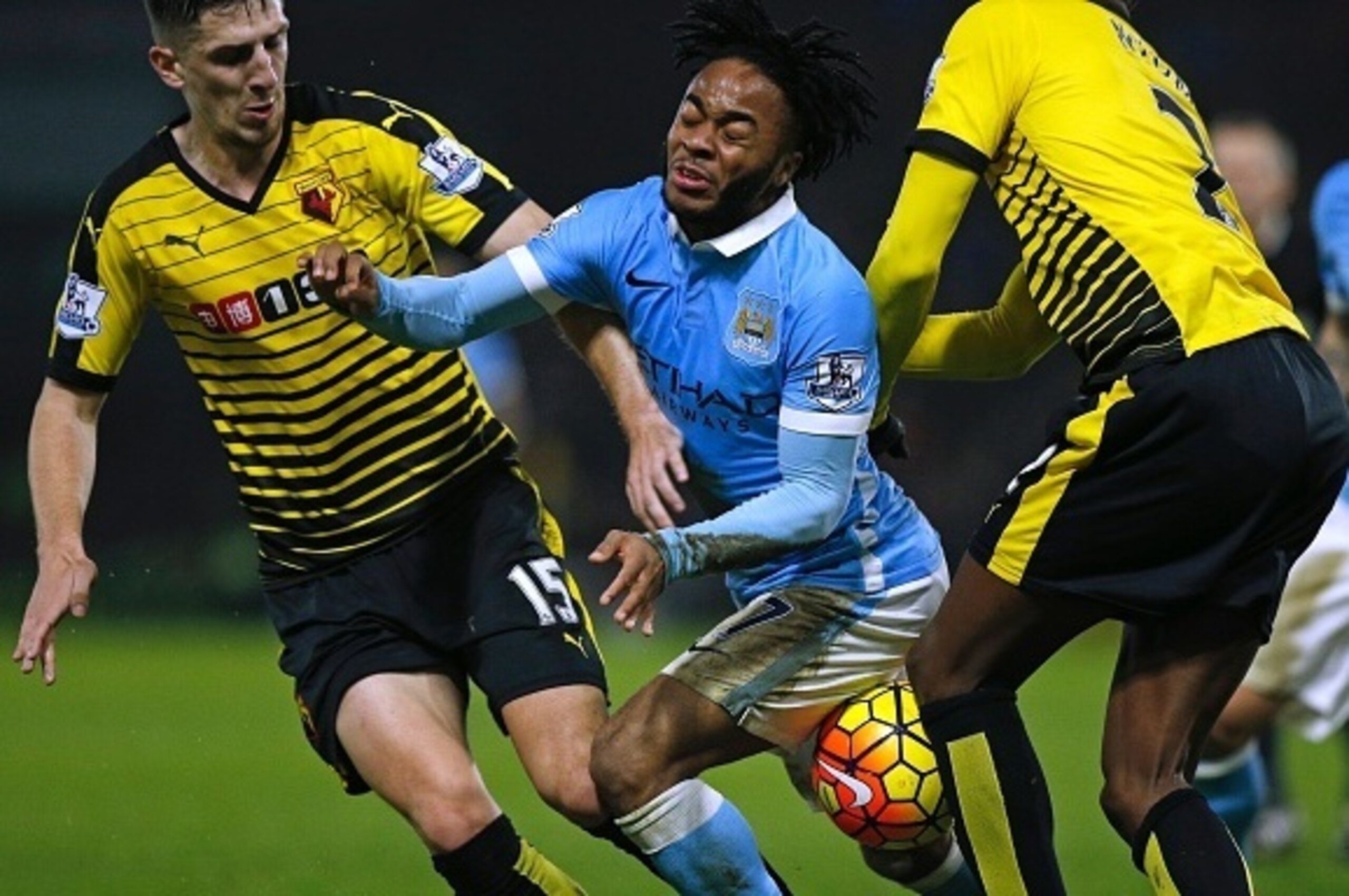 Manchester City's English midfielder Raheem Sterling (C) vies with Watford's Northern Irish defender Craig Cathcart (L) and Watford's Cameroonian defender Allan Nyom during the English Premier League football match between Watford and Manchester City at V