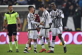 TURIN, ITALY - DECEMBER 16:  Paul Pogba (R) of FC Juventus celebrates his goal with team mates Alvaro Morata (C) and Paulo Dybala during the TIM Cup match between FC Juventus and Torino FC at Juventus Arena on December 16, 2015 in Turin, Italy.  (Photo by