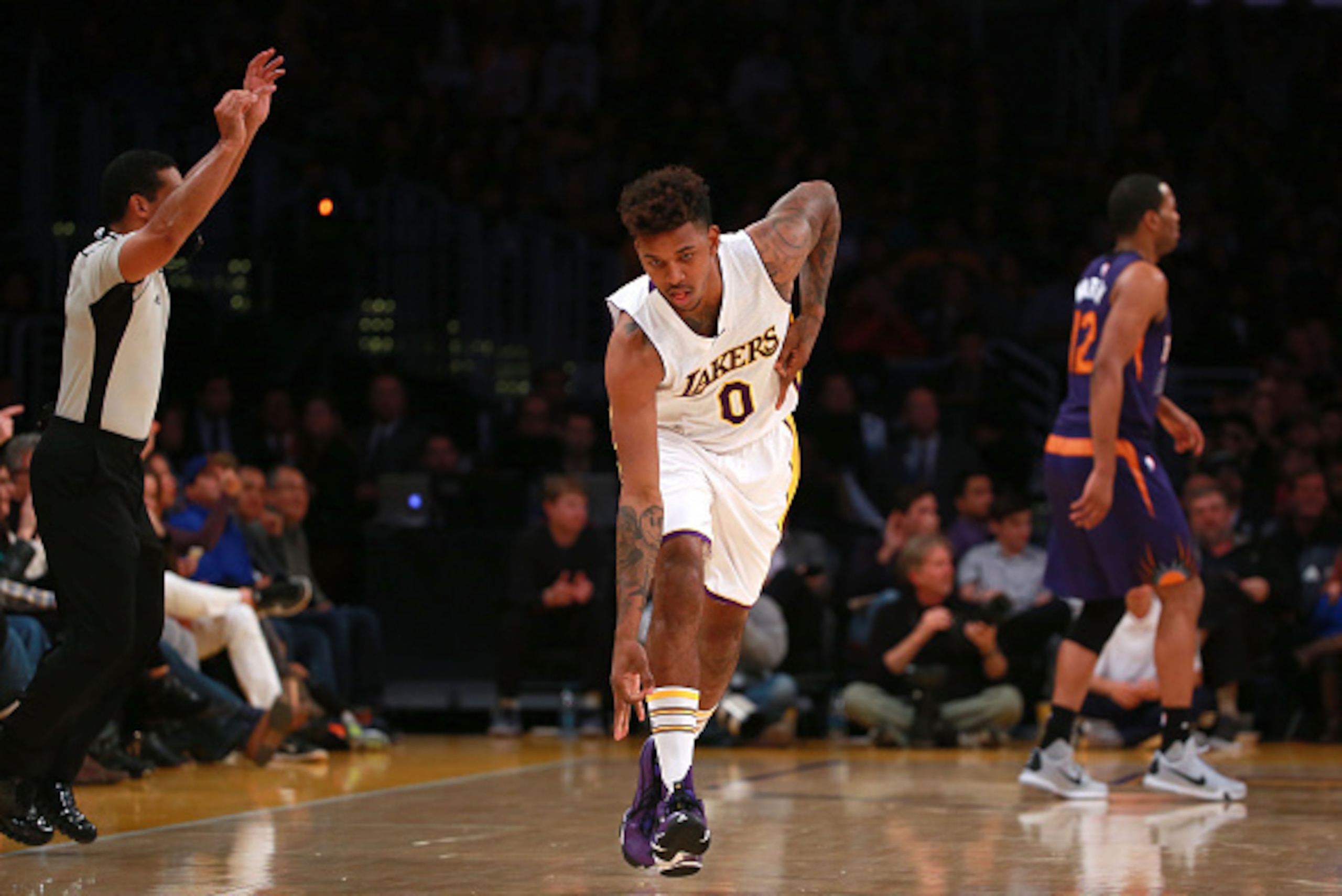 LOS ANGELES, CA - JANUARY 03:  Nick Young #0 of the Los Angeles Lakers reacts after scoring on a three-point jump shot against the Phoenix Suns in the second half during the NBA game at Staples Center on January 3, 2016 in Los Angeles, California. The Lak