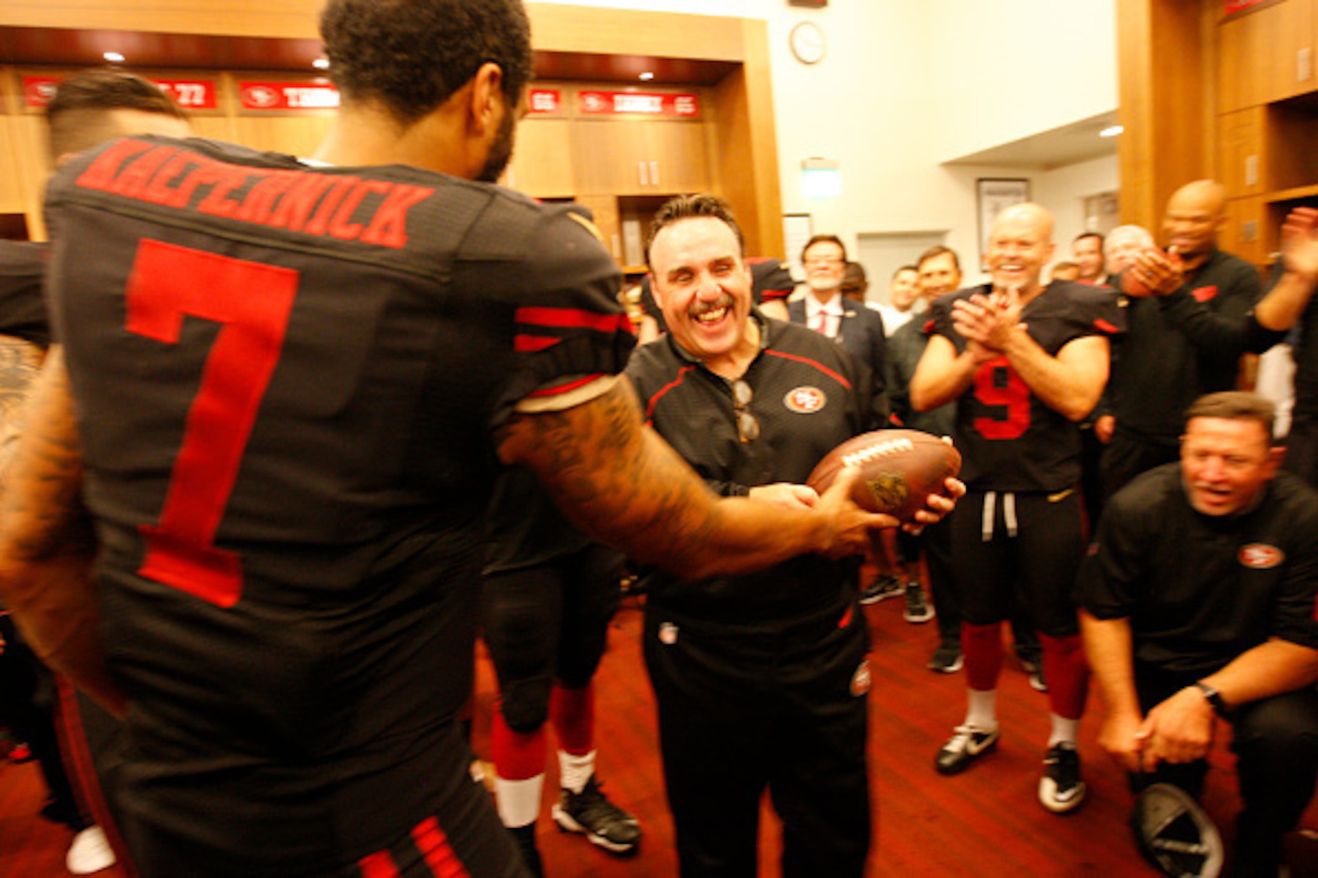 SANTA CLARA, CA - SEPTEMBER 14: Colin Kaepernick #7 of the San Francisco 49ers presents Head Coach Jim Tomsula with the game ball following the game against the Minnesota Vikings at Levi Stadium on September 14, 2015 in Santa Clara, California. The 49ers 