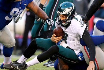 EAST RUTHERFORD, NJ - JANUARY 03:   Sam Bradford #7 of the Philadelphia Eagles is sacked by  Robert Ayers #91 of the New York Giants at MetLife Stadium on January 3, 2016 in East Rutherford, New Jersey.The Philadelphia Eagles defeated the New York Giants 