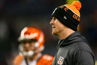 DENVER, CO - DECEMBER 28:  Quarterback Andy Dalton #14 of the Cincinnati Bengals looks on as players warm up before a game against the Denver Broncos at Sports Authority Field at Mile High on December 28, 2015 in Denver, Colorado. (Photo by Justin Edmonds