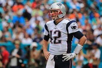 MIAMI GARDENS, FL - JANUARY 03: Tom Brady #12 of the New England Patriots looks on during the third quarter of the game against the Miami Dolphins at Sun Life Stadium on January 3, 2016 in Miami Gardens, Florida. (Photo by Mike Ehrmann/Getty Images)