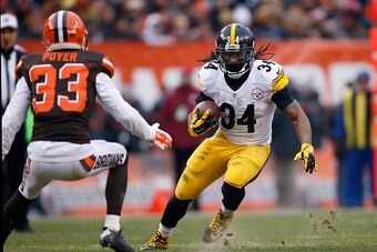 CLEVELAND, OH - JANUARY 3:  DeAngelo Williams #34 of the Pittsburgh Steelers carries the ball in front of the defense of Jordan Poyer #33 of the Cleveland Browns during the second quarter at FirstEnergy Stadium on January 3, 2016 in Cleveland, Ohio.  (Pho