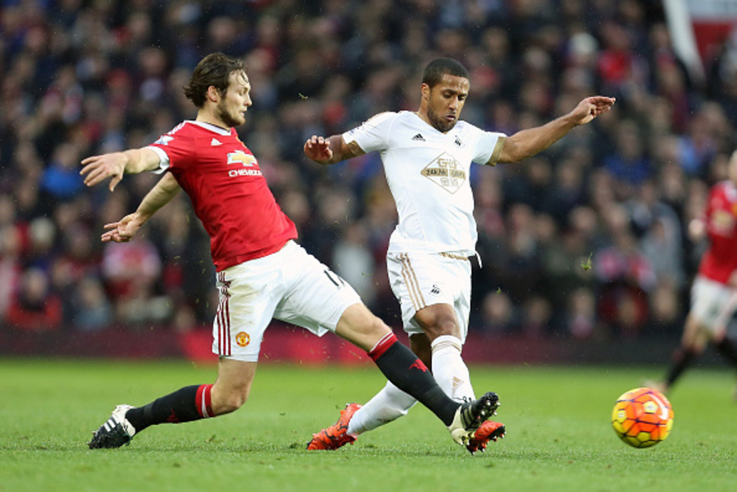 MANCHESTER, ENGLAND - JANUARY 02: Daley Blind of Manchester United and Wayne Routledge of Swansea City during the Barclays Premier League match between Manchester United and Swansea City at Old Trafford on January 2, 2016 in Manchester, England.  (Photo b