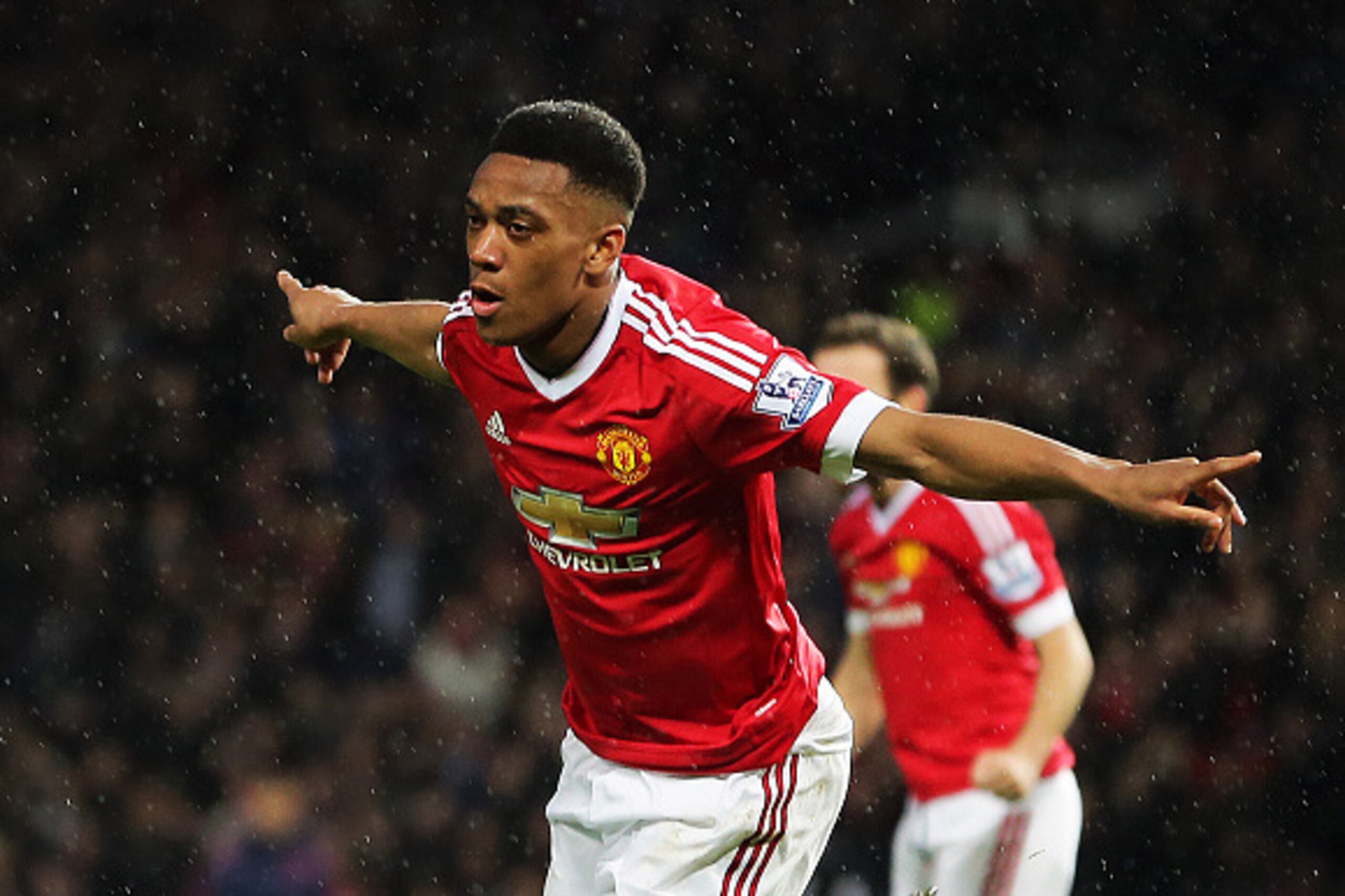 MANCHESTER, ENGLAND - JANUARY 02: Anthony Martial of Manchester United celebrates after scoring a goal to make it 1-0 during the Barclays Premier League match between Manchester United and Swansea City at Old Trafford on January 2, 2016 in Manchester, Eng
