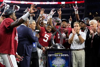 ARLINGTON, TX - DECEMBER 31:  Head coach Nick Saban of the Alabama Crimson Tide celebrates with the trophy after defeating the Michigan State Spartans 38 to 0 in the Goodyear Cotton Bowl at AT&T Stadium on December 31, 2015 in Arlington, Texas.  (Photo by