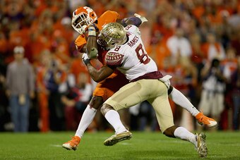 CLEMSON, SC - NOVEMBER 07:  Jalen Ramsey #8 of the Florida State Seminoles misses a tackle against Wayne Gallman #9 of the Clemson Tigers during their game at Memorial Stadium on November 7, 2015 in Clemson, South Carolina.  (Photo by Streeter Lecka/Getty