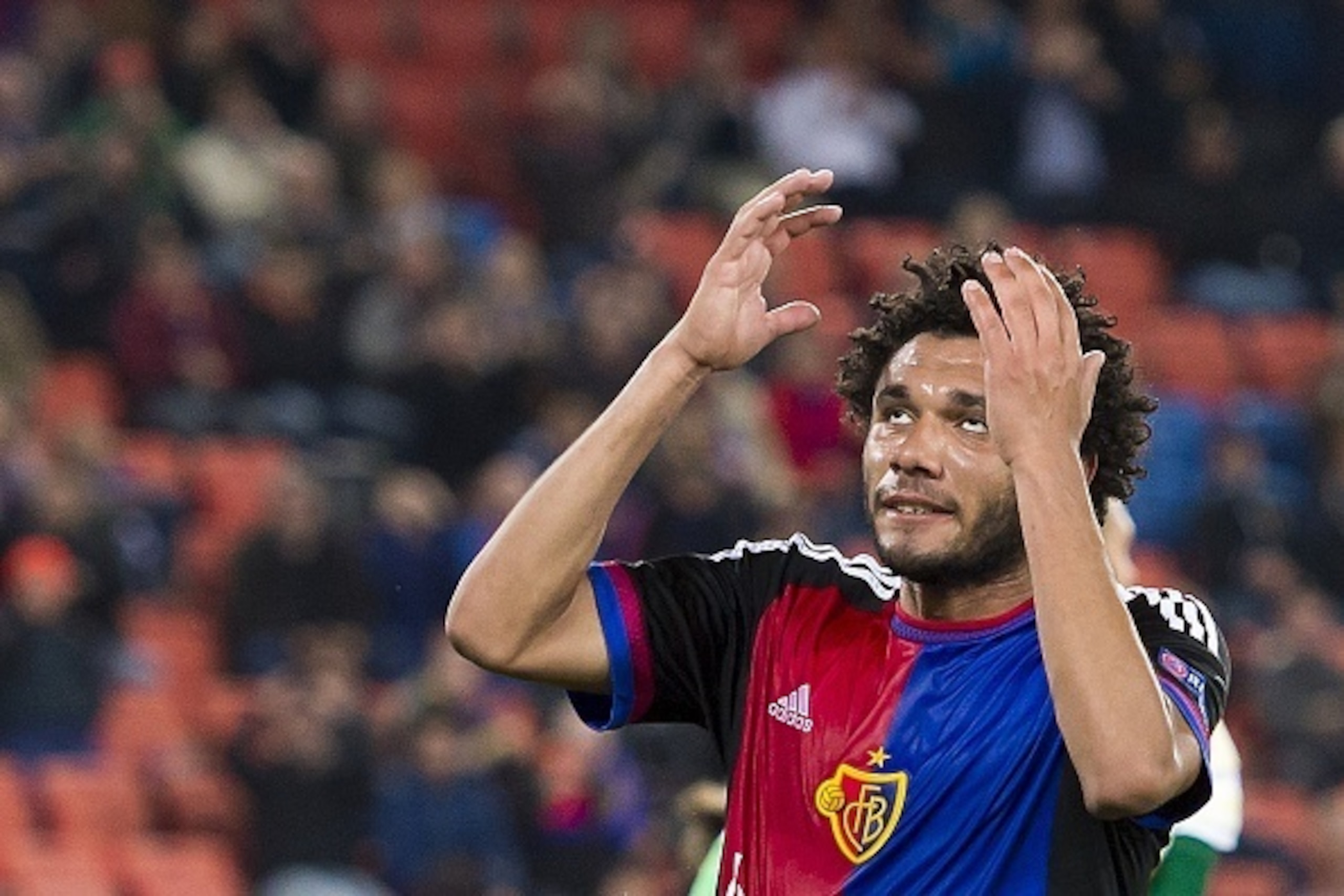 Basel's Egyptian midfielder Mohamed Elneny reacts after missing a goal opportunity during the UEFA Europa League football match between  FC Basel and KKS Lech Poznan at St. Jakob Park stadium in Basel on October 1, 2015. AFP PHOTO / FABRICE COFFRINI      