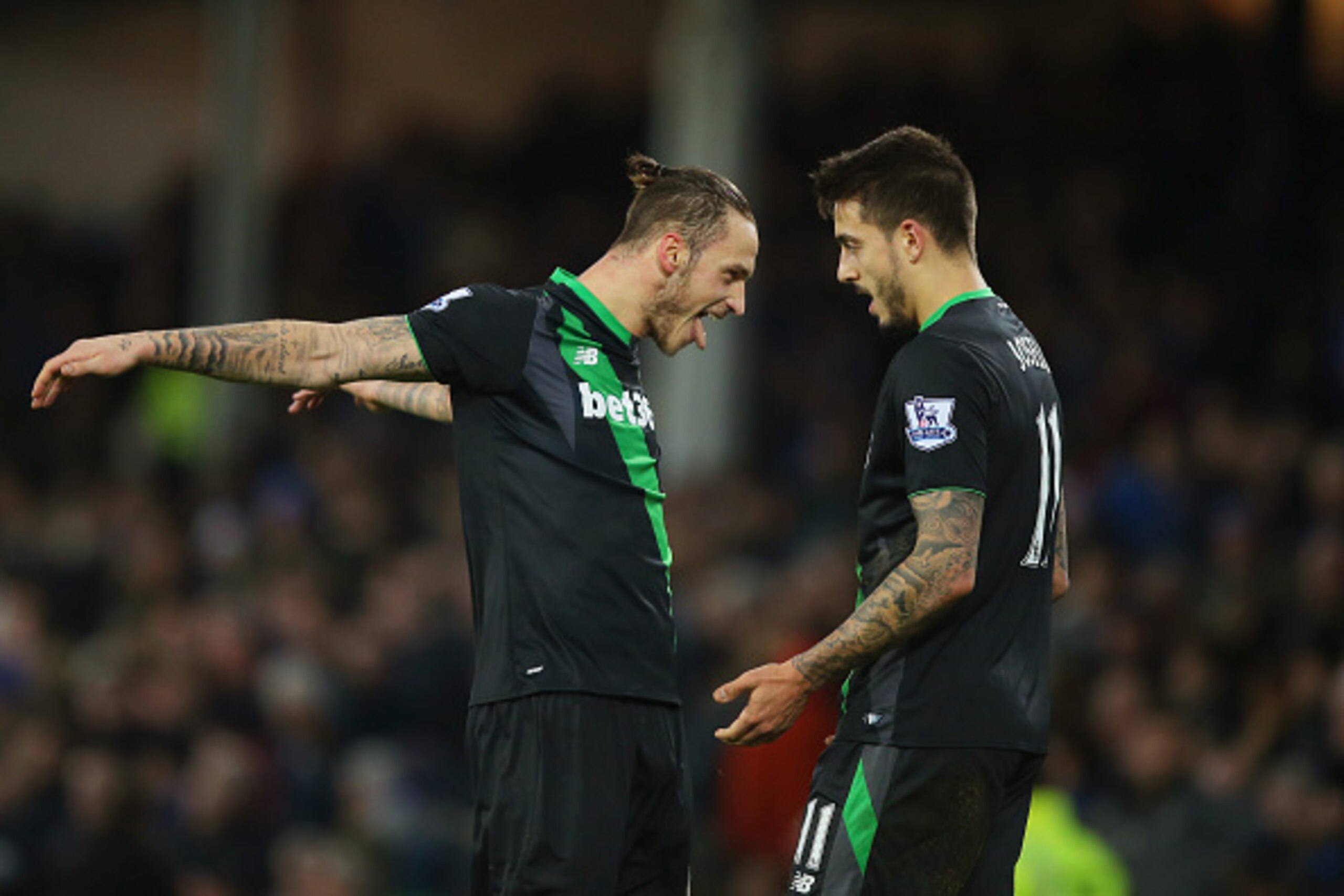 LIVERPOOL, ENGLAND - DECEMBER 28:  Marko Arnautovic (L) of Stoke City celebrates his team's win with Joselu (R) in the Barclays Premier League match between Everton and Stoke City at Goodison Park on December 28, 2015 in Liverpool, England.  (Photo by Dav