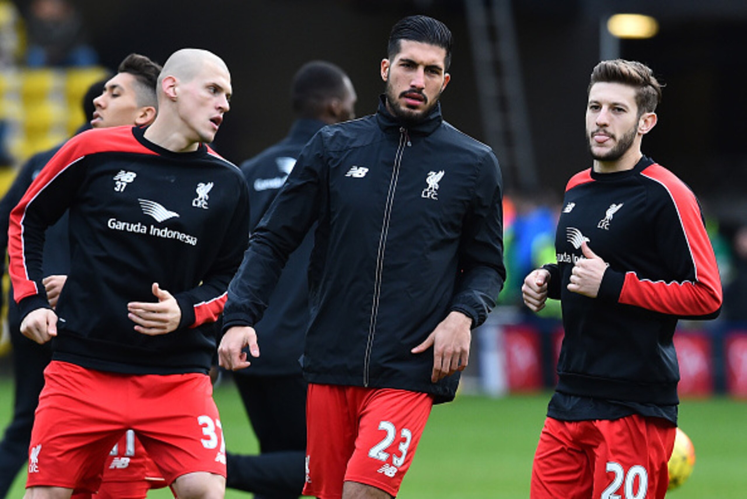 Liverpool's Slovakian defender Martin Skrtel (L), Liverpool's German midfielder Emre Can and Liverpool's English midfielder Adam Lallana (R) warm up ahead of the English Premier League football match between Watford and Liverpool at Vicarage Road Stadium 
