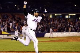 NEW YORK - MAY 6:  Mike Piazza #31 of the New York Mets celebrates after hitting a walk-off solo home run in the eleventh inning against the San Francisco Giants on May 6, 2004, at Shea Stadium in Flushing, New York. The Mets won 2-1. (Photo by Ezra Shaw/