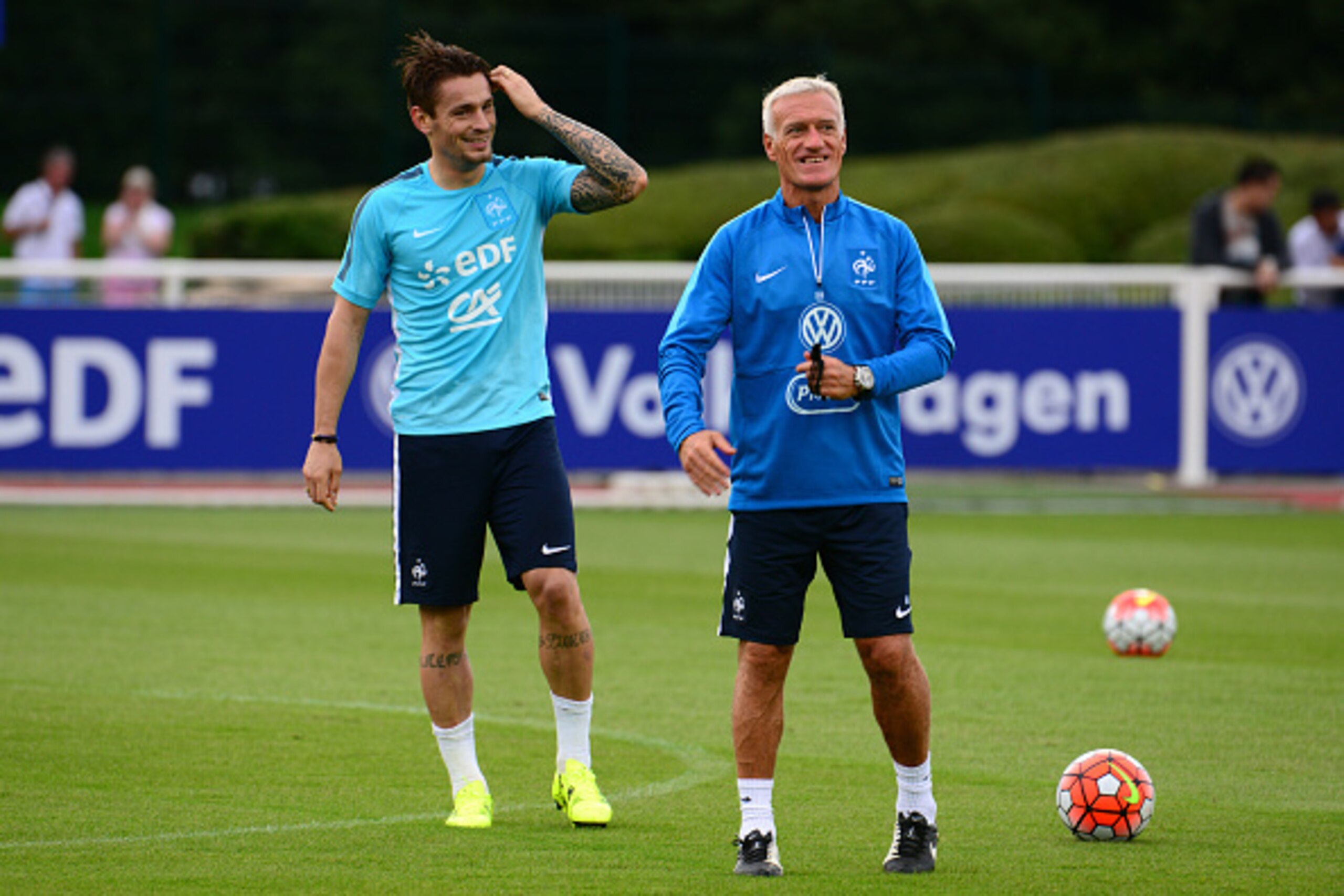 CLAIREFONTAINE, FRANCE - AUGUST 31: France head coach Didier Deschamps and defender Mathieu Debuchy during a training session at the French national football team centre in Clairefontaine-en-Yvelines, on August 31, 2015 in Clairefontaine, France. (Photo b