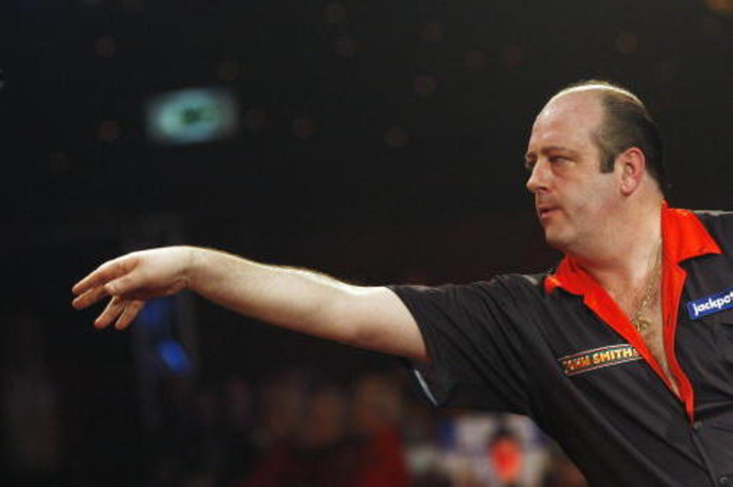 Ted 'The Count' Hankey of England throws a dart during the game against Tony 'The Silverback' O'shea during The Lakeside World Darts Championships Final match in Frimley Green on January 11, 2009. Two-time world champion Hankey won the match 7-6 sets. AFP