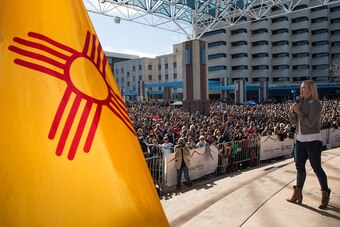 ALBUQUERQUE, NM - DECEMBER 06:  UFC women's bantamweight champion Holly Holm talks to her hometown crowd during the UFC Champion Holly Holm Welcome Home Parade at Civic Plaza on December 6, 2015 in Albuquerque, New Mexico. (Photo by Brandon Magnus/Zuffa L