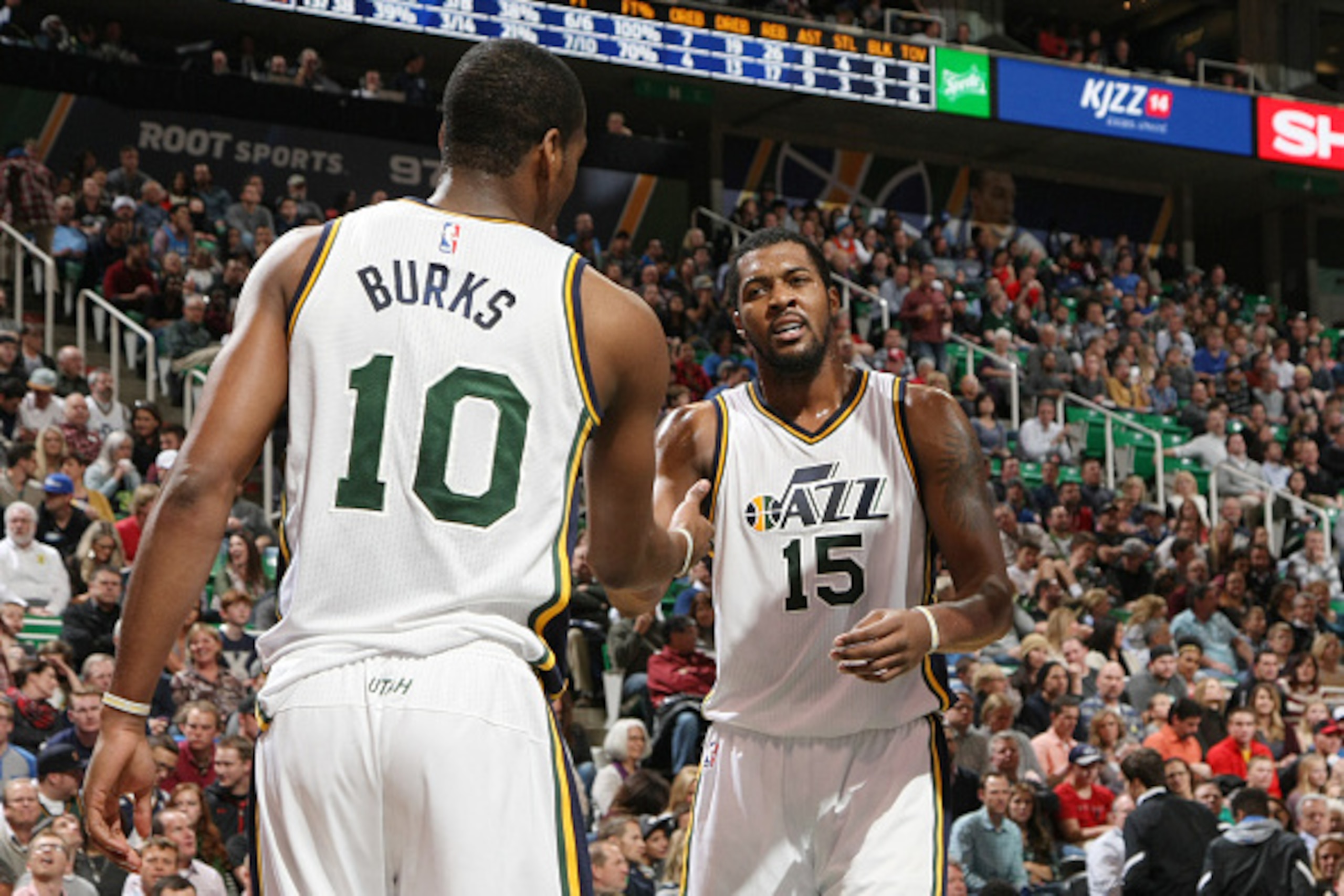 SALT LAKE CITY, UT - DECEMBER 11: Alec Burks #10 high fives teammate Derrick Favors #15 of the Utah Jazz during the game against the Oklahoma City Thunder on December 11, 2015 at Vivint Smart Home Arena in Salt Lake City, Utah. NOTE TO USER: User expressl