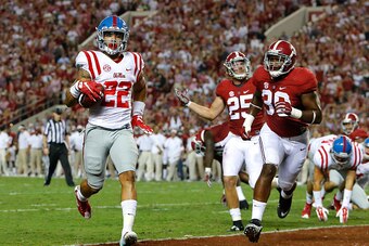 TUSCALOOSA, AL - SEPTEMBER 19:  Jordan Wilkins #22 of the Mississippi Rebels scores a touchdown past Denzel Devall #30 of the Alabama Crimson Tide at Bryant-Denny Stadium on September 19, 2015 in Tuscaloosa, Alabama.  (Photo by Kevin C. Cox/Getty Images)