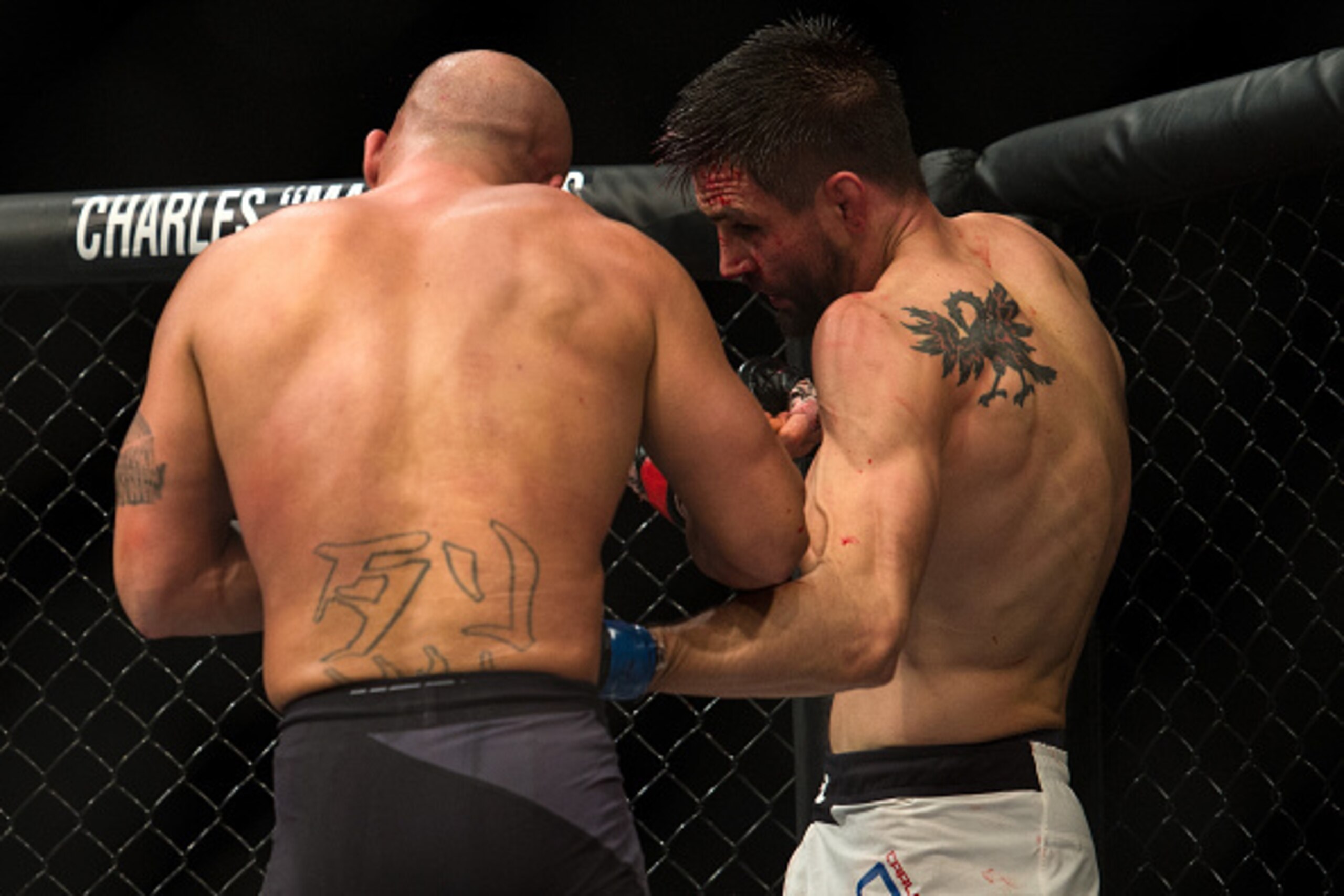LAS VEGAS, NV - JANUARY 02:  (R-L) Carlos Condit punches Robbie Lawler in their welterweight championship fight during the UFC 195 event inside MGM Grand Garden Arena on January 2, 2016 in Las Vegas, Nevada.  (Photo by Brandon Magnus/Zuffa LLC/Zuffa LLC v